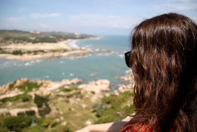 Rear view of woman at beach