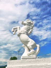 Low angle view of statue against sky