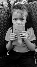 Portrait of cute girl sitting