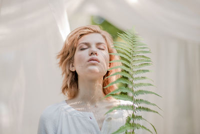 Portrait of young woman looking away