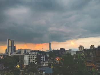 Cityscape against sky during sunset