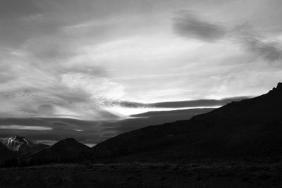 Scenic view of silhouette mountains against sky