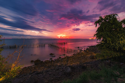 Scenic view of sea against sky during sunset