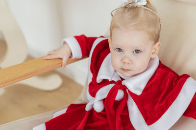 Portrait of cute girl holding gift