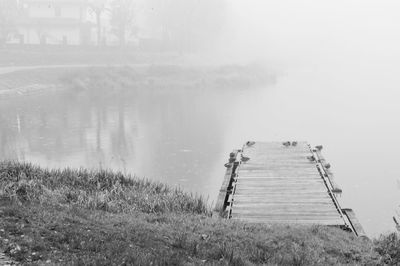 Scenic view of lake during foggy weather