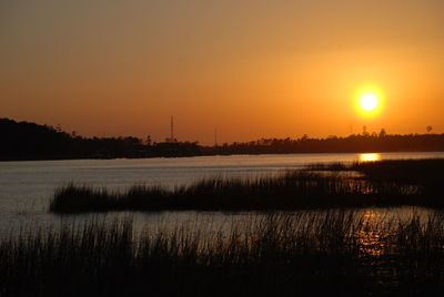 Scenic view of sunset over lake