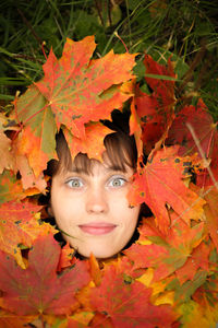 Portrait of girl with autumn leaves