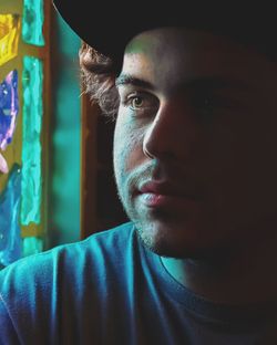 Close-up portrait of young man looking away