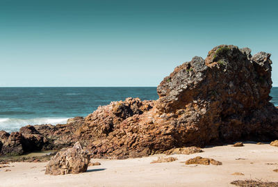 Scenic view of beach against clear sky