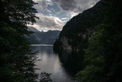 Scenic view of lake and mountains against sky