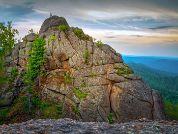 Rock formations on mountain against sky