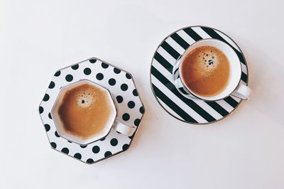 High angle view of coffee cup on table