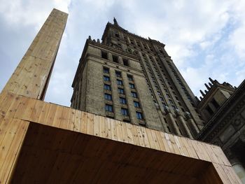 Low angle view of building against cloudy sky