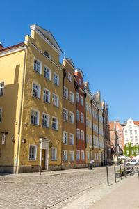 Residential buildings against blue sky