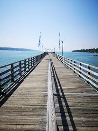 Pier over sea against sky