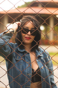 Portrait of beautiful young woman standing outdoors