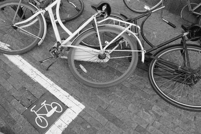 High angle view of bicycle parked on footpath