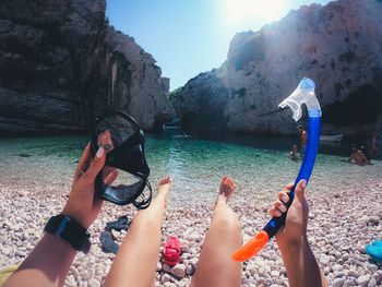 Close-up of woman holding scuba diving gear