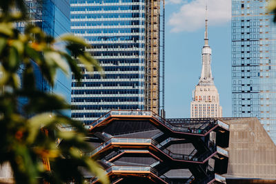 Modern buildings in city against sky