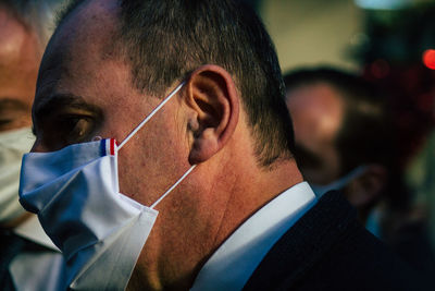 Close-up portrait of man wearing mask