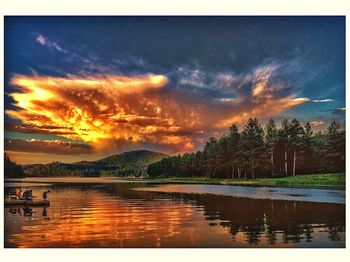 Scenic view of lake against cloudy sky