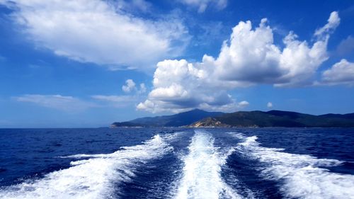 Panoramic view of sea against blue sky