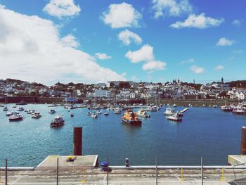 Boats moored at harbor