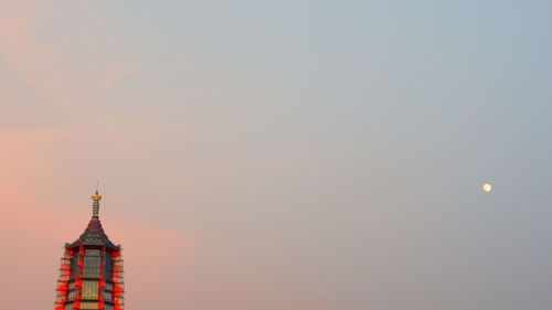 Low angle view of building against sky during sunset