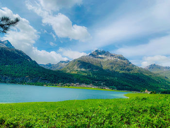 Scenic view of landscape and mountains against sky