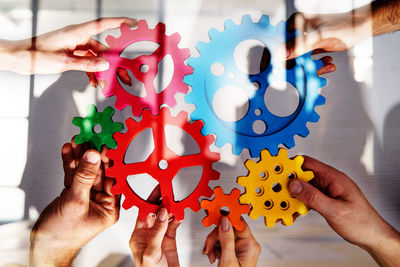 Cropped hand of woman holding jigsaw puzzle