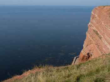 High angle view of landscape and sea against sky