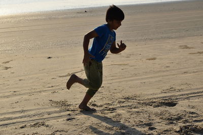 Full length of boy on beach