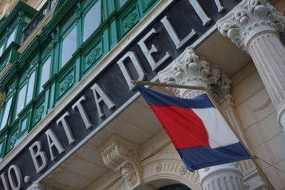 Low angle view of flag against building