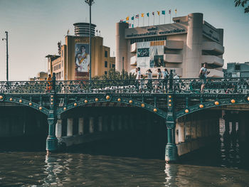 Bridge over river with buildings in background