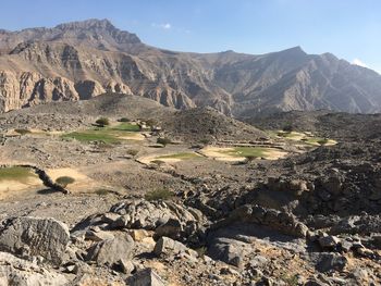 Scenic view of landscape and mountains against sky