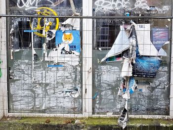 Graffiti on glass window of building