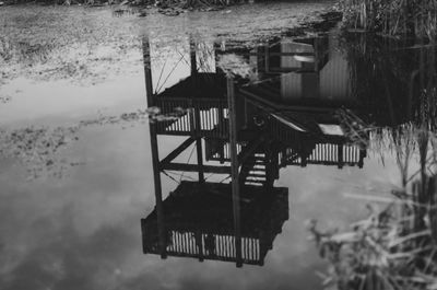 Gazebo in lake against sky