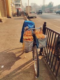 Rear view of man riding bicycle on street