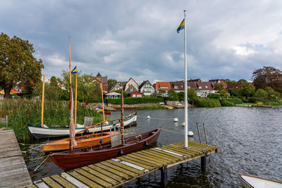 Boats in sea against sky