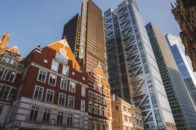 Low angle view of skyscrapers against clear sky