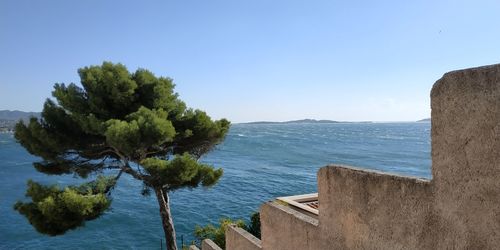 Scenic view of sea against clear blue sky