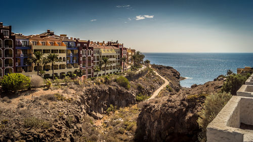 Panoramic view of sea and buildings against sky