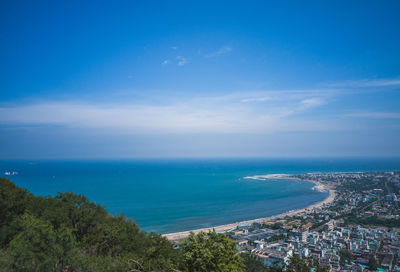 Scenic view of sea against blue sky