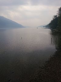 View of lake against cloudy sky