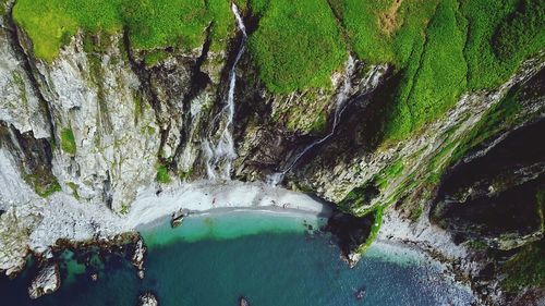 High angle view of rocks in sea