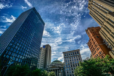 Low angle view of modern buildings against sky