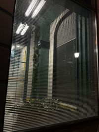 Low angle view of glass window in building