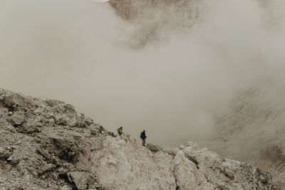 Hikers on rocky mountains