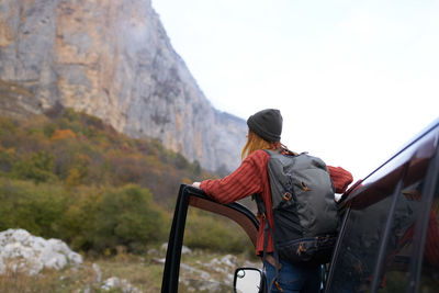 Rear view of man looking at mountain