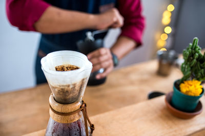 Close-up of ground coffee in container on table